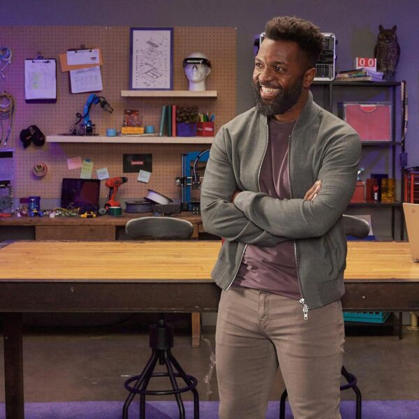 Baratunde Thurston hangs out by the massive wooden workbench in the Lenovo Late Night I.T. garage